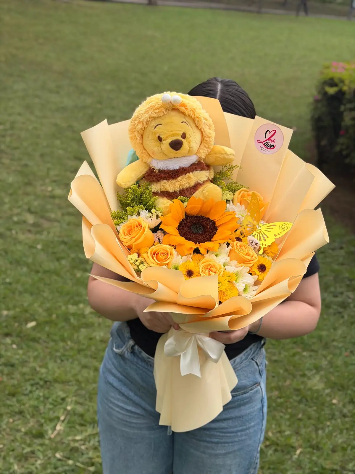 Ramo amarillo con flores y peluche